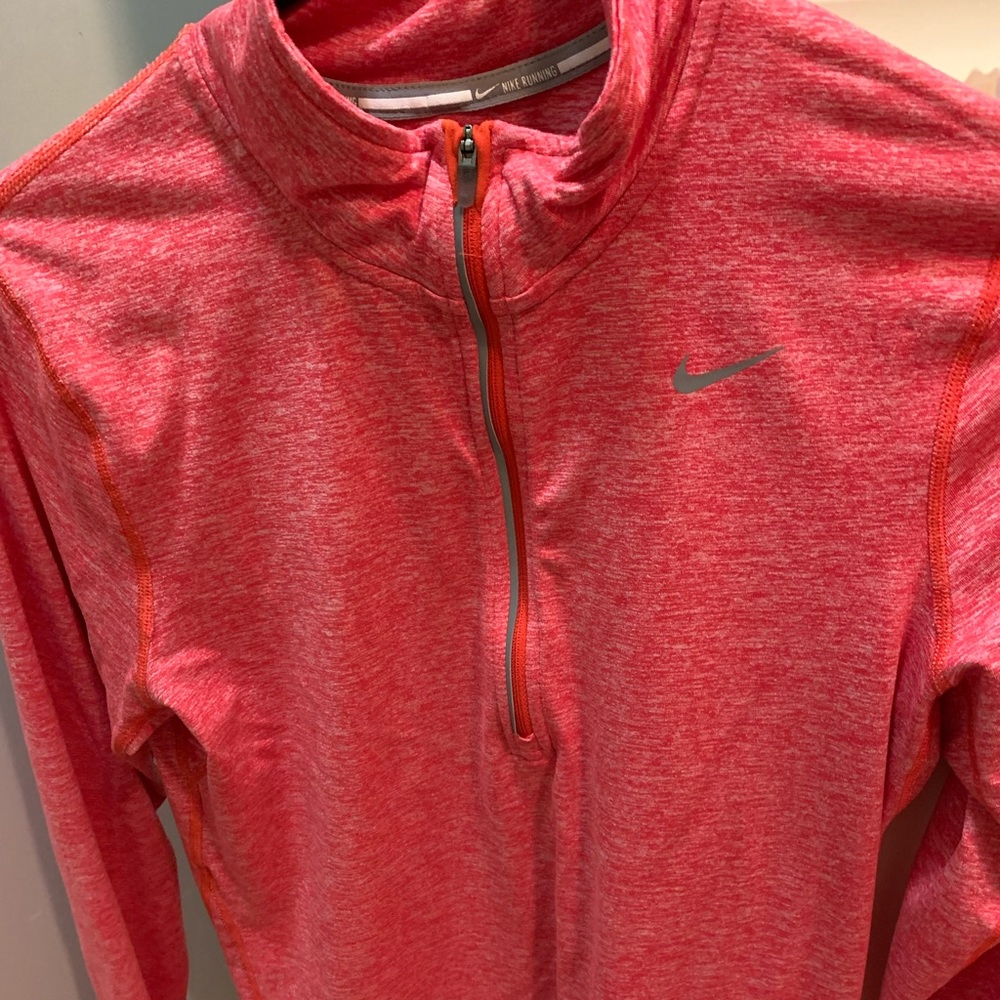 Women’s Nike orange pullover. Partial zip. Nonsmoking home. Excellent shape.